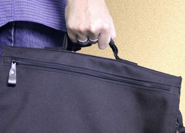 person carrying a laptop bag